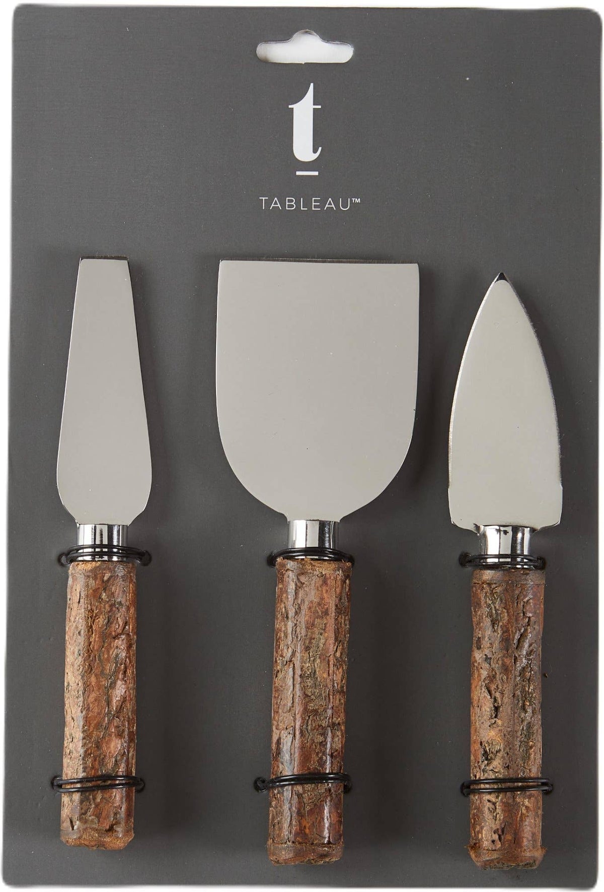 A 3-piece Tableau cake and pastry server set in its original dark gray retail packaging. The set includes a flat server, a spatula, and a smaller server, each with a brushed silver metal blade and a textured brown cork-patterned handle.
