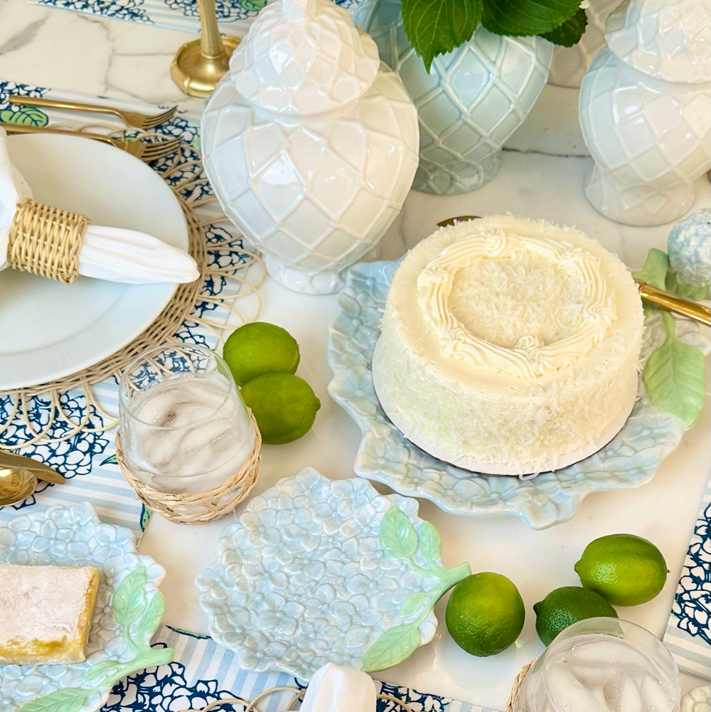 Elegant table setting with decorative plates, napkins, and centerpieces.