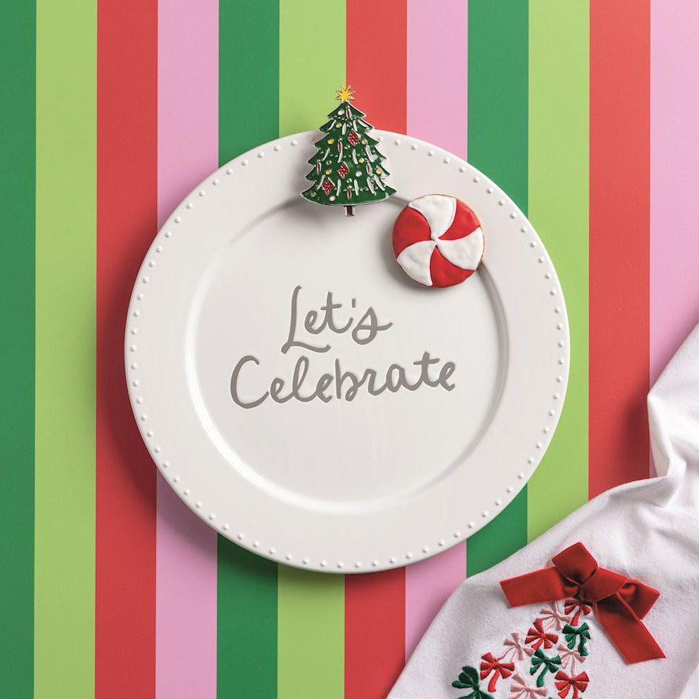 Decorative plate with 'Let's Celebrate' text on a striped background