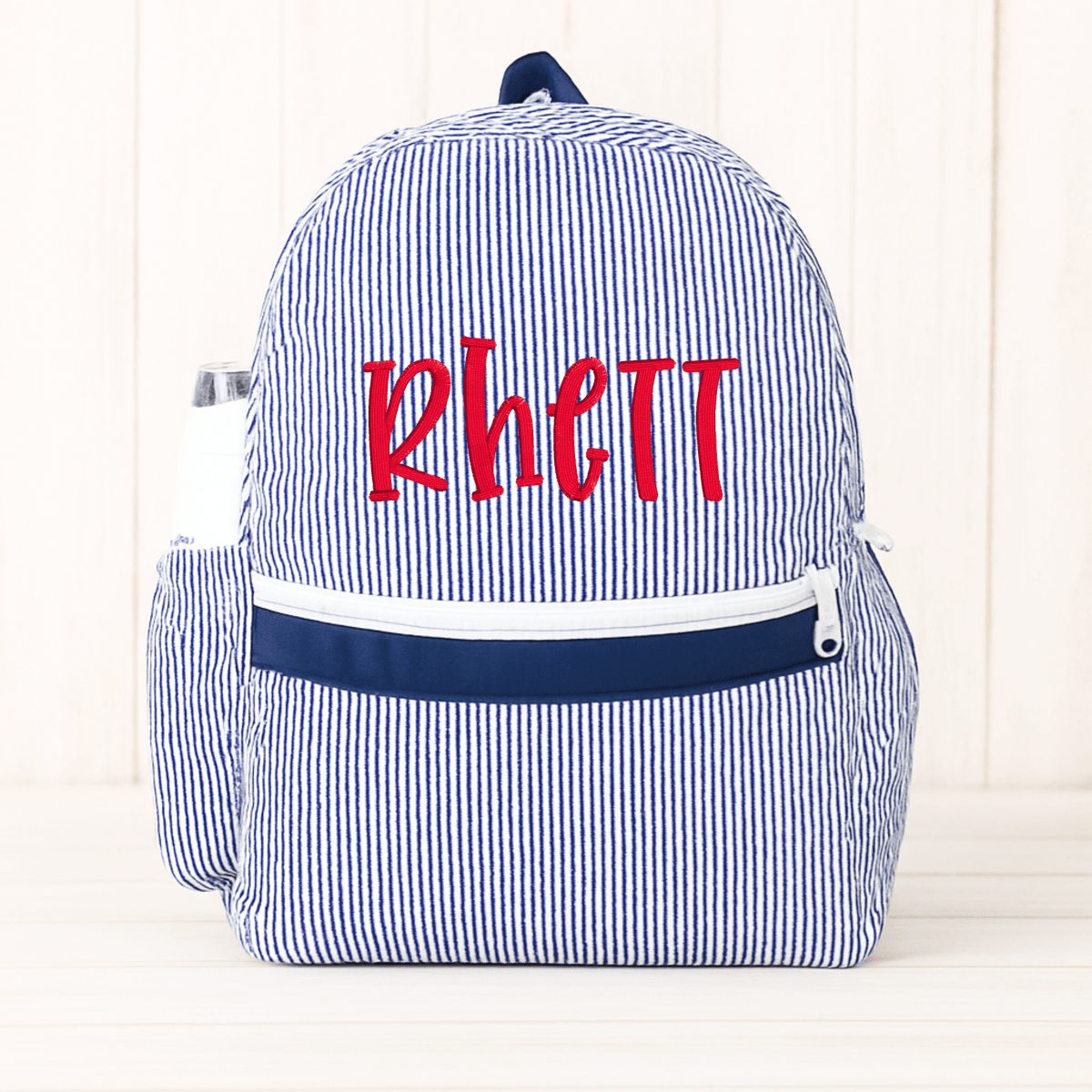 Oh Mint! Monogrammed Navy Seersucker Medium Backpack | CeCe's Home & Gifts
