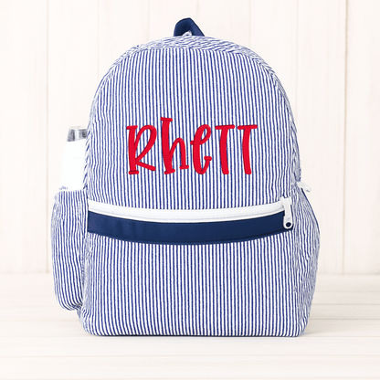 Oh Mint! Monogrammed Navy Seersucker Medium Backpack | CeCe's Home & Gifts
