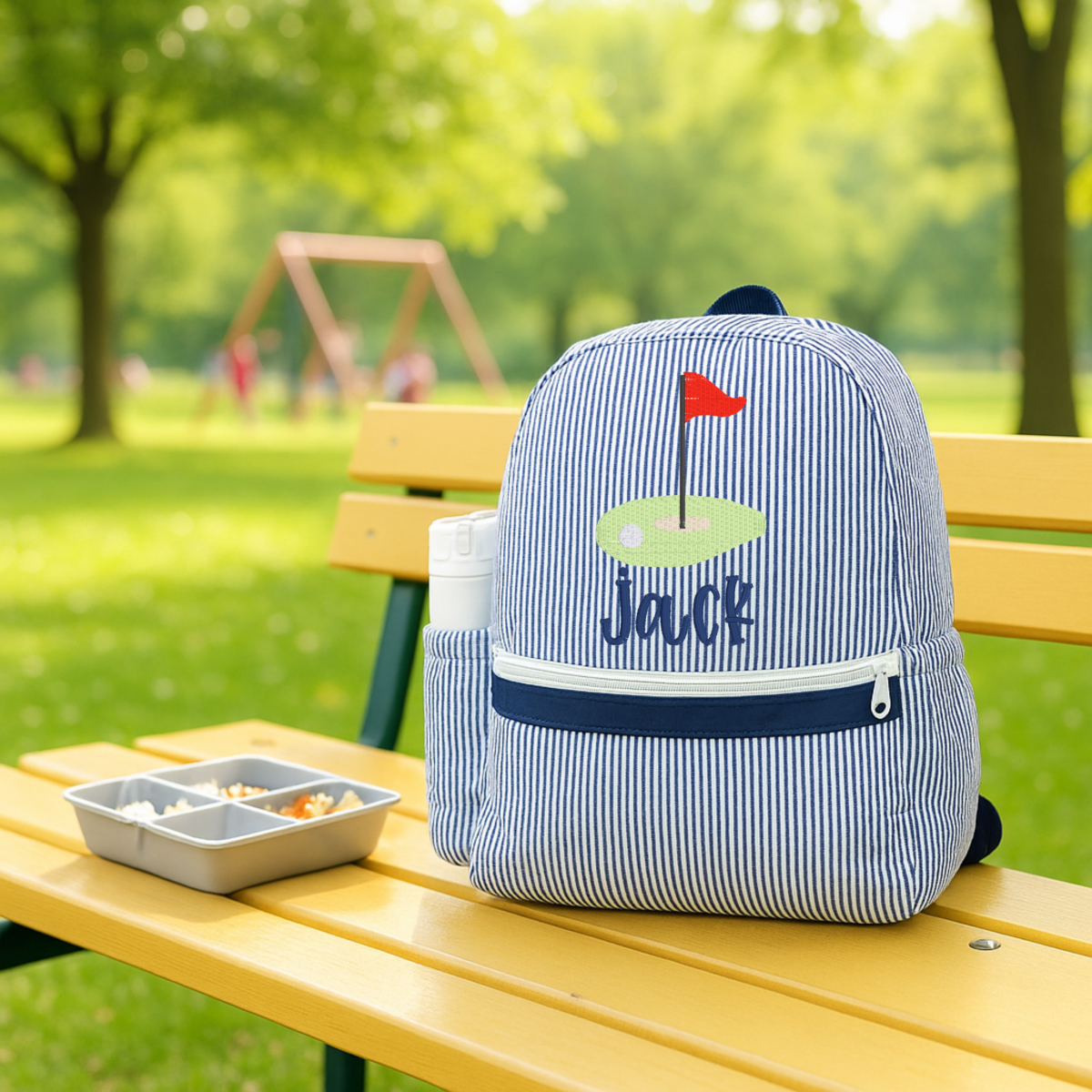 Oh Mint! Monogrammed Navy Seersucker Medium Backpack | CeCe's Home & Gifts