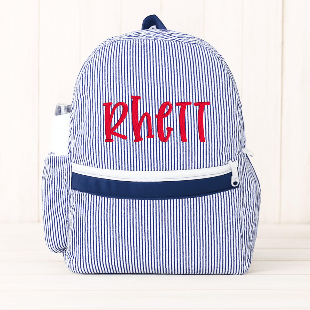 Oh Mint! Monogrammed Navy Seersucker Medium Backpack | CeCe's Home & Gifts