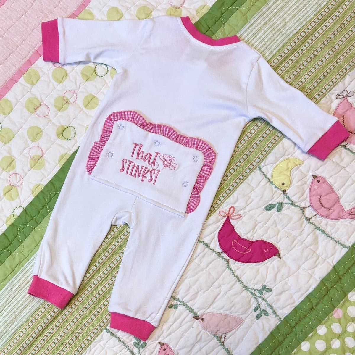 CeCe's Home & Gifts "That Stinks" Baby Girl Ruffle Bottom Romper | CeCe's Home & Gifts